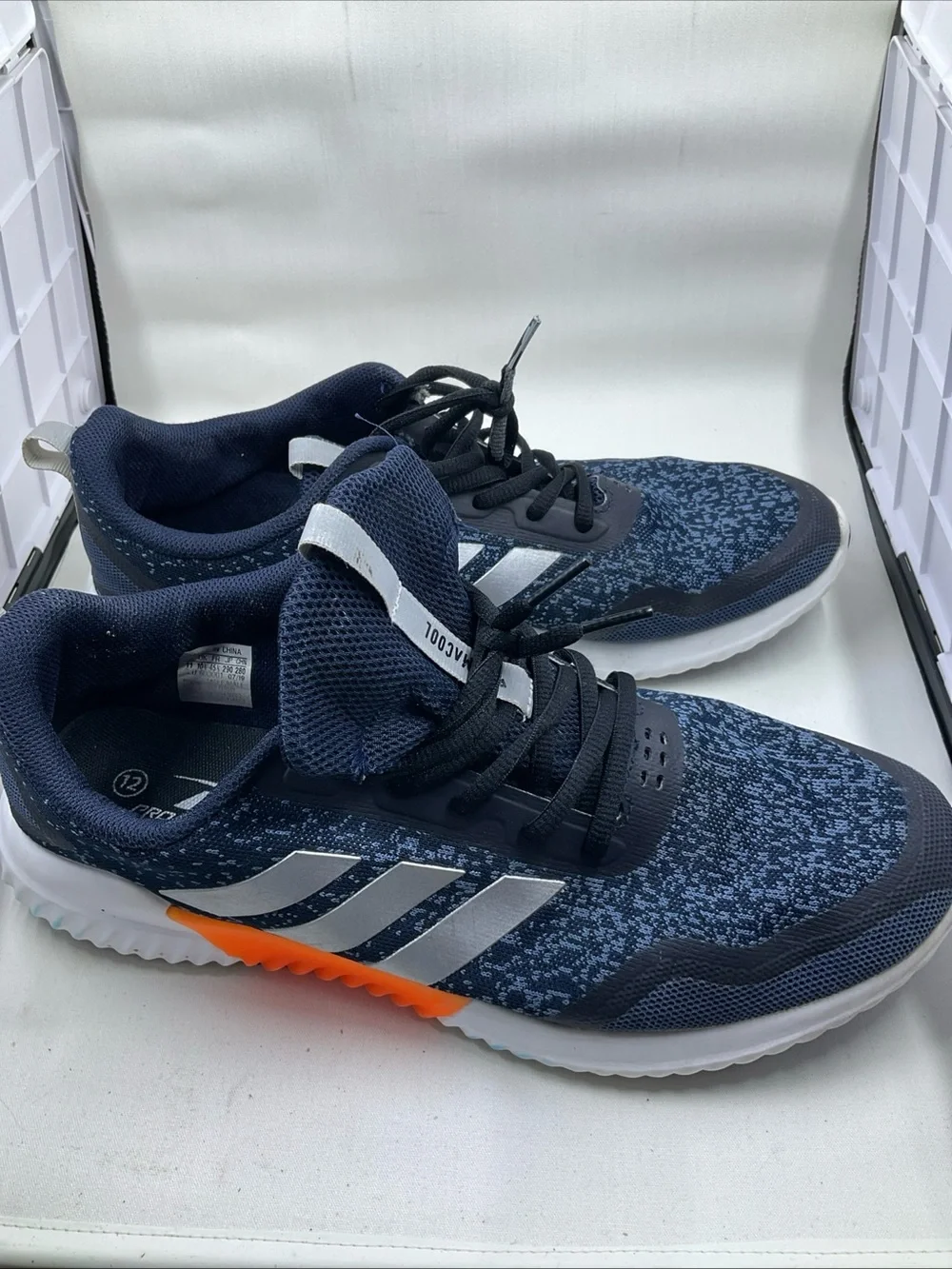 adidas Men's Navy Blue Athletic Shoes with Silver Stripes and Orange Accent